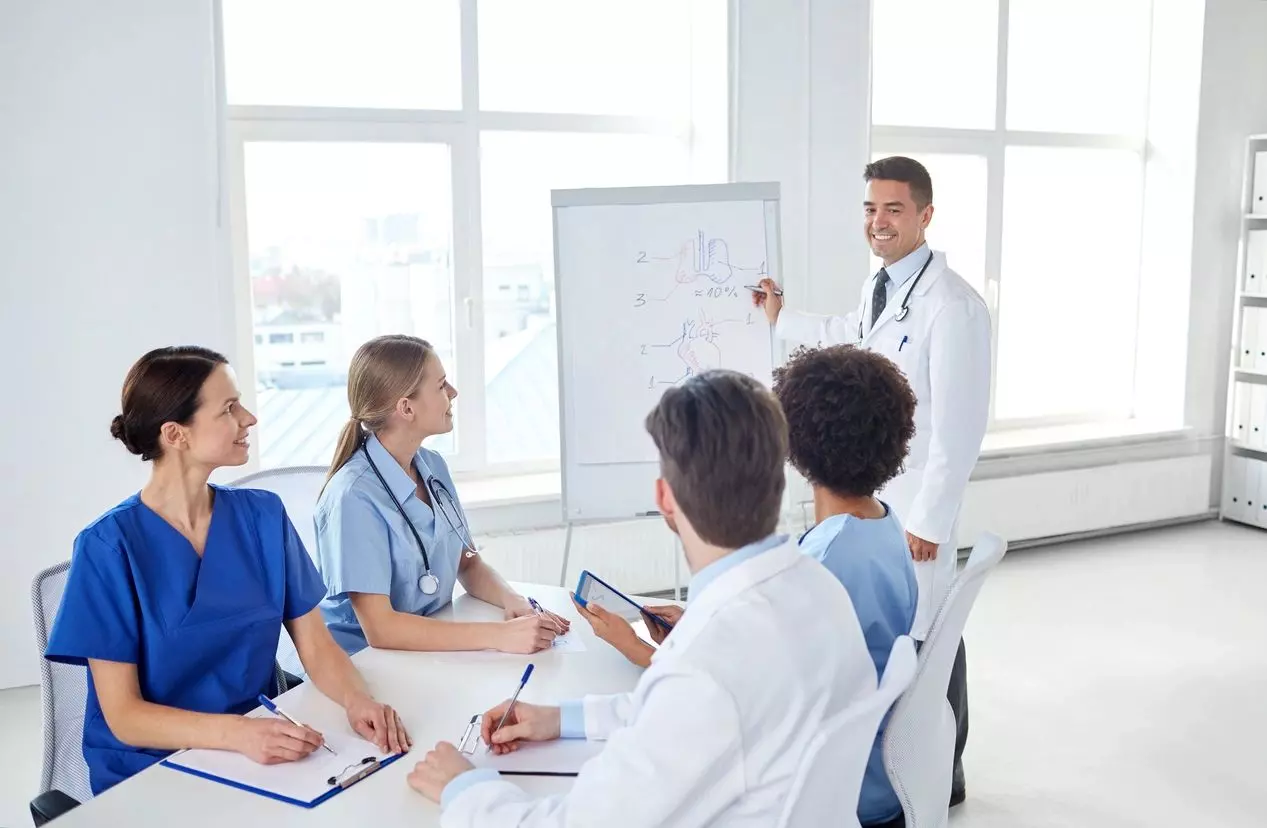 Group of doctors talking to each other about a plan